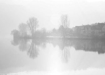 Fototapeta na wymiar Misty view across the river Mosel in Zell Germany