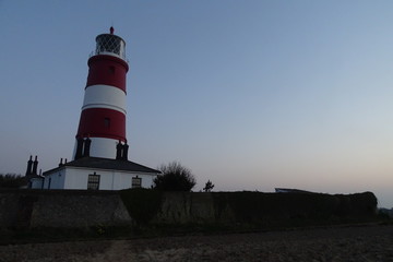 Fototapeta na wymiar Sunset views of Happisburgh Lighthouse - Norfolk, England, UK