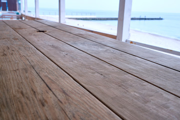 Wooden table by the sea, bottom view