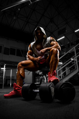 Body Builder Exercise With Weights at the Gym