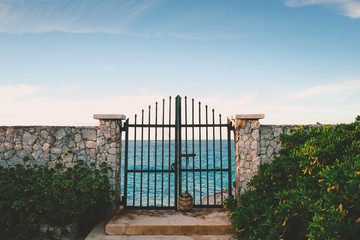 Paradise Island, Bahamas, a gate in front of the ocean