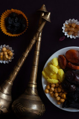 Eid Mubarak. Different iftar sweets. Celebrating Eid Al Adha. Islamic traditional holiday. Eid al-Fitr. Holly month Ramadan. Middle Eastern religious holiday. Dried date fruit. Flat lay, top view.