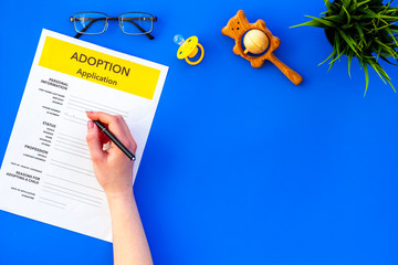 application form for adopt child on blue background top view mock up