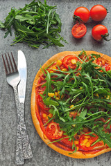 Vegan pizza with fresh arugula, corn and tomatoes. Healthy pizza.