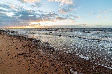 storm weather on the beach by rocky sea shore