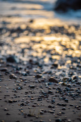 storm weather on the beach by rocky sea shore