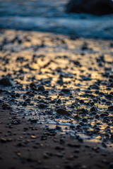 storm weather on the beach by rocky sea shore