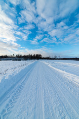 Fototapeta na wymiar snowy winter road covered in ice and snow