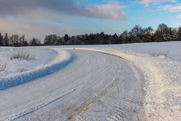 snowy winter road covered in ice and snow