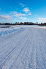 Fototapeta na wymiar snowy winter road covered in ice and snow