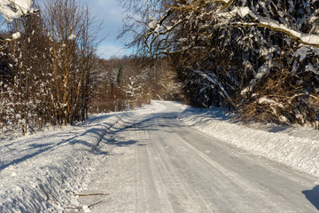 snowy winter road covered in ice and snow