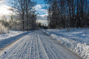 snowy winter road covered in ice and snow