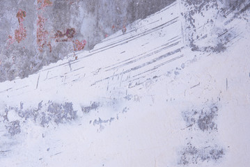 Fototapeta na wymiar Background concrete wall with shabby white paint texture