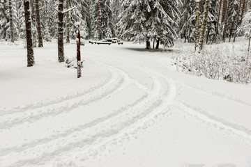 snowy winter road covered in ice and snow