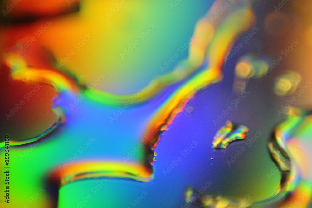 Poster abstract liquid colorful background with water droplets and splash on holographic surface
