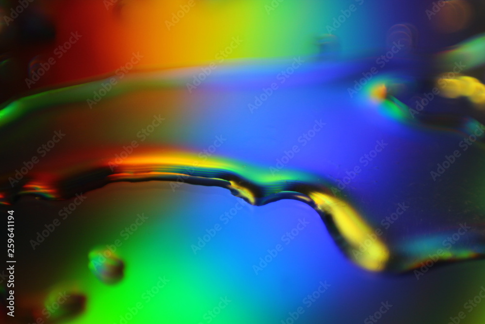 Poster abstract liquid colorful background with water droplets and splash on holographic surface