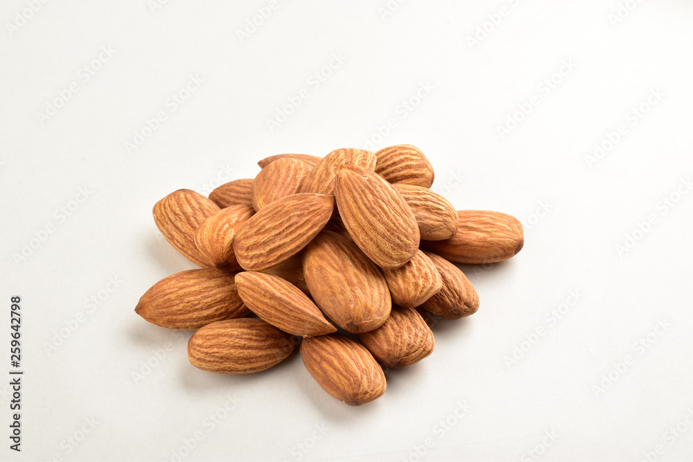 Wall mural Closeup of almonds, isolated on the white background. - Wall murals