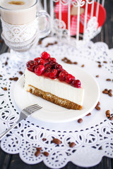 Cherry cake with latte on a white wipes