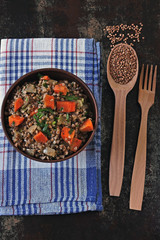 Homemade buckwheat porridge with vegetables in a bowl. Buckwheat diet concept. Healthy vegan food.