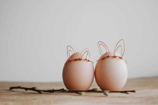 Easter DIY egg, made in bunny style. Minimal Easter concept, idea with rabbit. Craft hipster holiday.