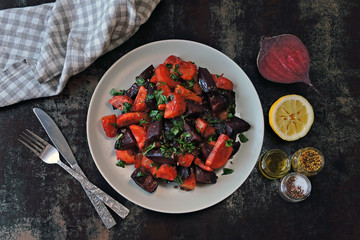 Warm vegan salad with baked vegetables. Salad with pumpkin, beet and carrot. Healthy eating concept. Salad to cleanse the body. Flat Lay.