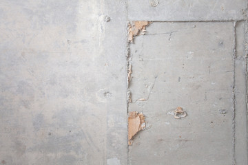 Formwork traces on concrete. Repair and construction or constructing. Concrete background. Grey color. Cement texture. Poor quality curve wall. Flaws, defects and cracks in the wall. .
