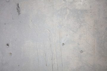 Formwork traces on concrete. Repair and construction or constructing. Concrete background. Grey color. Cement texture. Poor quality curve wall. Flaws, defects and cracks in the wall. .