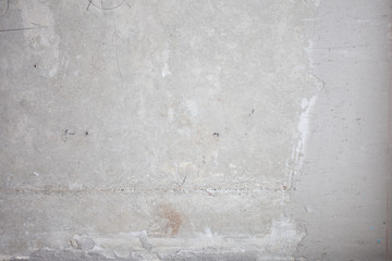 Formwork traces on concrete. Repair and construction or constructing. Concrete background. Grey color. Cement texture. Poor quality curve wall. Flaws, defects and cracks in the wall. .
