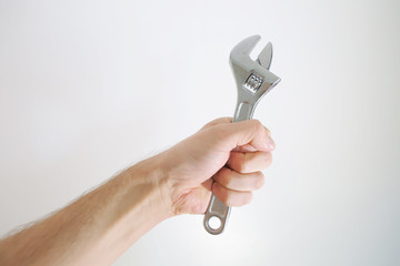 wrench in hand as a repair symbol