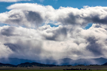 Rain and Rain Clouds Above Valley Floor