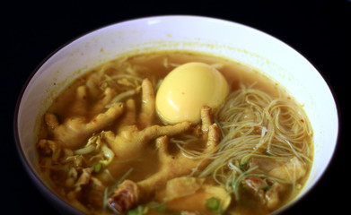 Soto ceker or chicken feet soup on white background. 