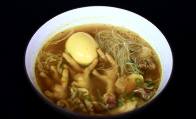 Soto ceker or chicken feet soup on white background. 