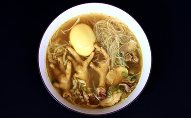 Soto ceker or chicken feet soup on white background. 