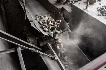 Industrial belt conveyor moving raw materials from mine - obrazy, fototapety, plakaty