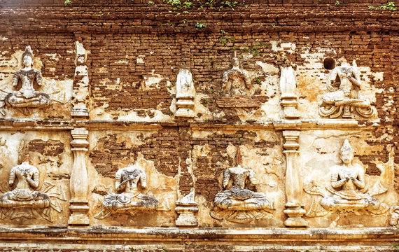 Buddhist sculpture on old wall