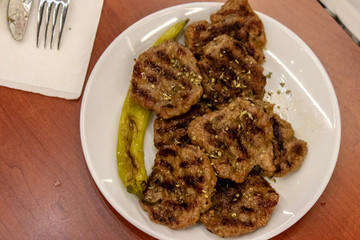 an upper view shoot to meat and some fried pepper