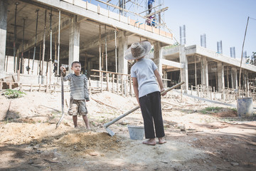 Children who work hard on the construction site, child labor , World Day Against Child Labour concept.