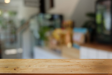 Empty dark wooden table in front of abstract blurred bokeh background of restaurant . can be used for display or montage your products.Mock up for space.