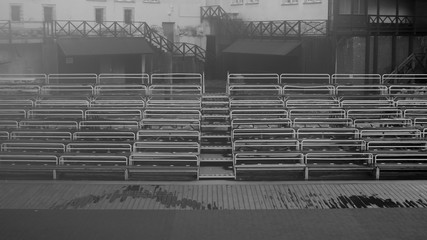 Empty benches on tribune with scene black and white background