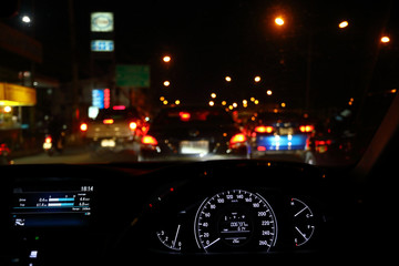 light of traffic jam on night city street