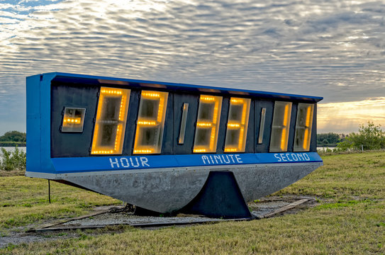 Countdown clock against morning sky in the Press Area at Kennedy Space Center - Powered by Adobe