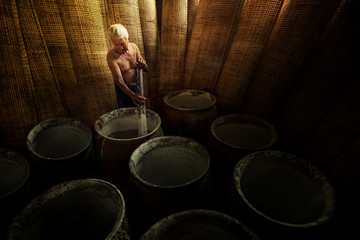 Thai men of Vietnamese descent making drying Vietnamese Rice Paper,Nongkhai,Thailand