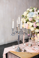 Wedding ceremony decoration. Decoration of wedding table with tender pink textile. Wedding decorated area.