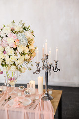 Wedding ceremony decoration. Decoration of wedding table with tender pink textile. Wedding decorated area.