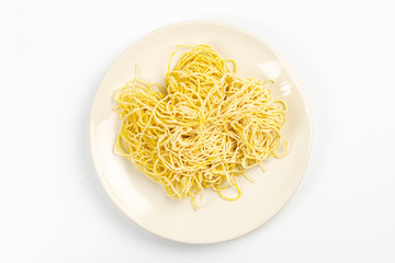 Yellow noodles are placed on a white background