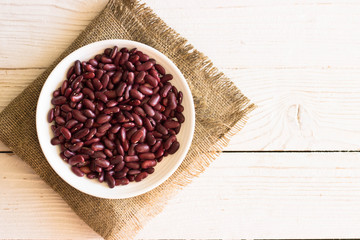 Grains Red bean on linen and wood background. 