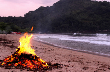 Bonfire on the beach of Camburi das Pedras in Ubatuba, São Paulo - Brazil.