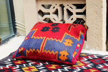 Vintage rug pillow. Colorful Oriental pillow. Pillow with traditional ancient patterns
