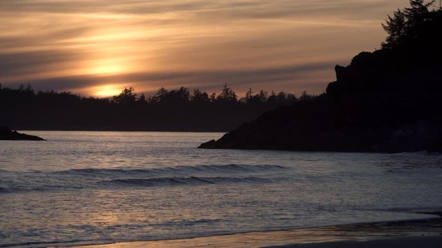 Mackenzie Beach at sunset on the west coast of Vancouver Island in Tofino. BC, Canada. 4K UHD.. 