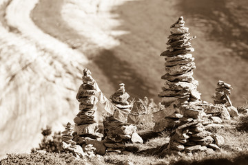 Glacier in the alps with buddhistic flags and stone tower